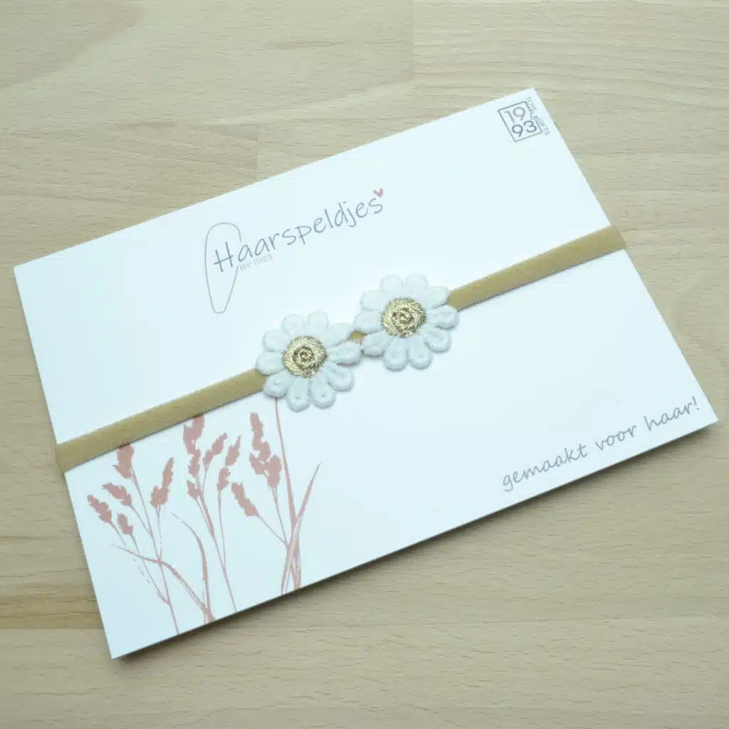 Nylon haarbandje voor baby. 2 madelief bloemetjes. Wit met gouden Daisy bloem