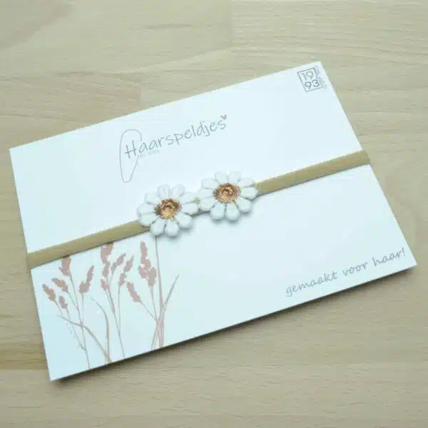 Nylon haarbandje voor baby. 2 madelief bloemetjes. Wit met bronzen Daisy bloem.