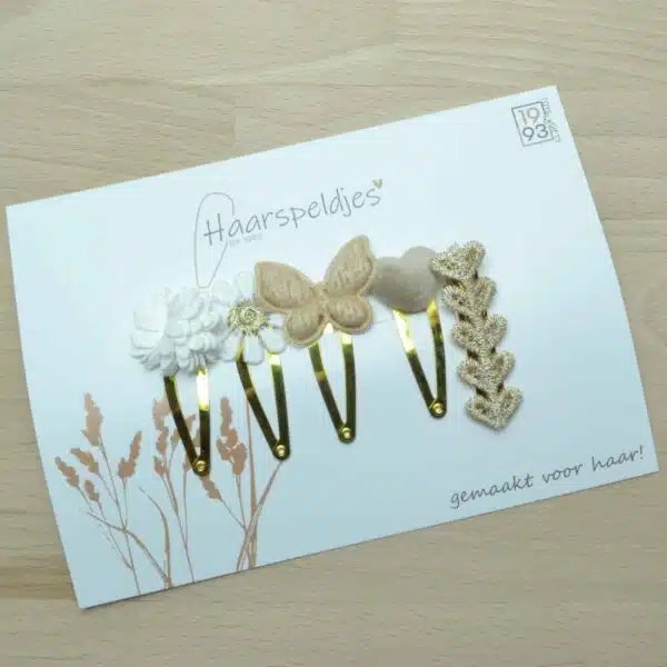 Gouden klik klak haarspeldjes met vlinder en madelief bloem